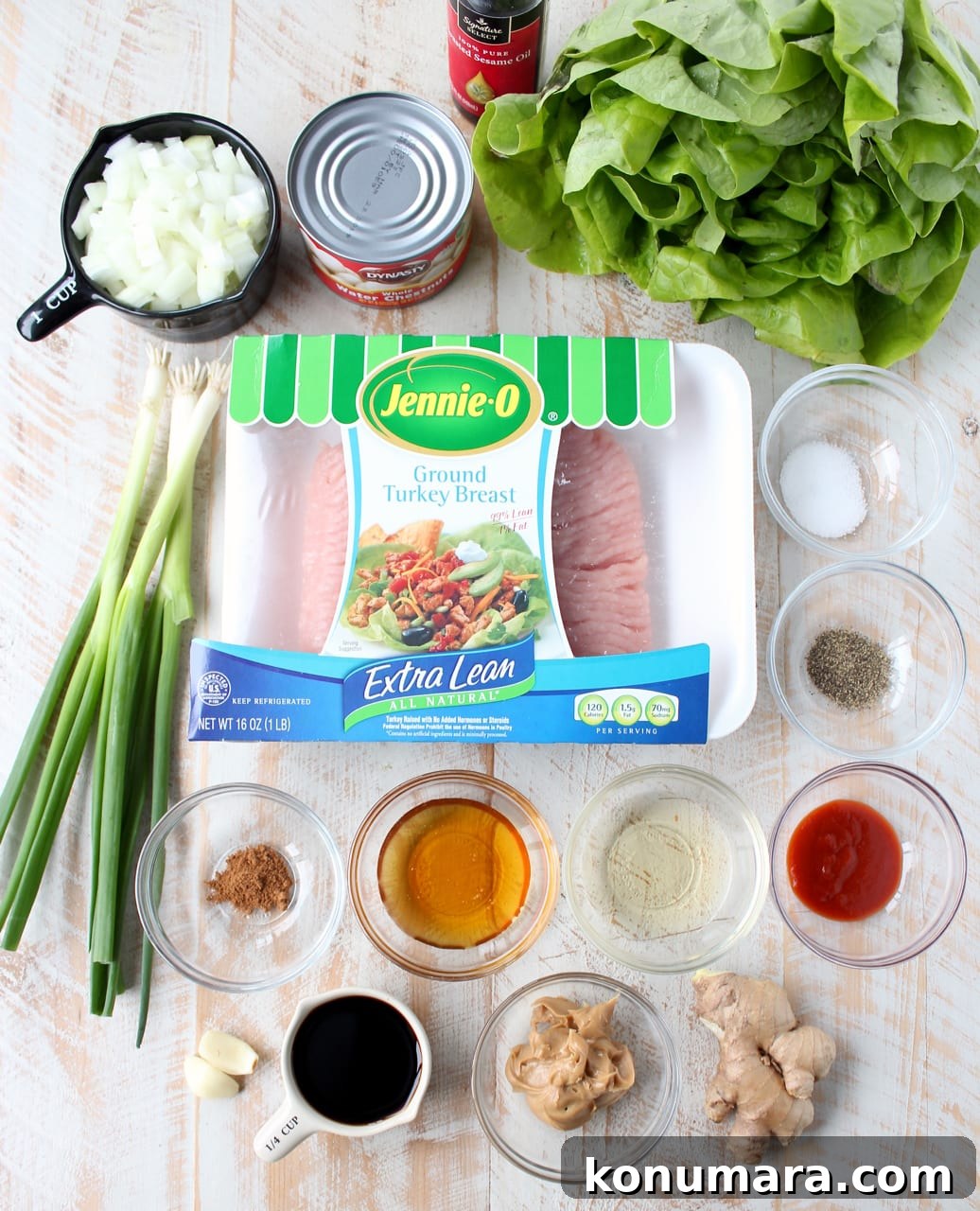 ingredients for turkey lettuce wraps on a white wood board