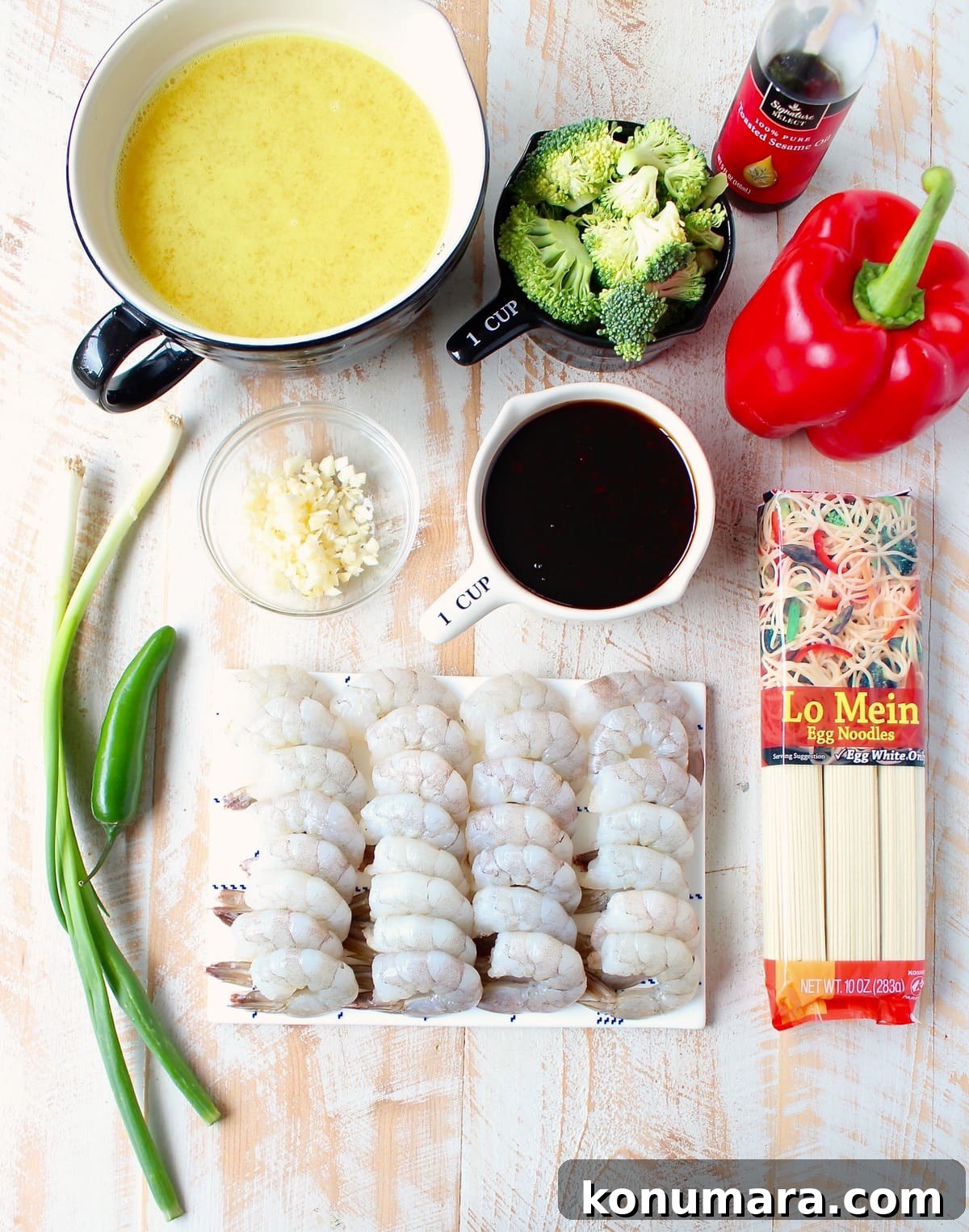 One Pot Teriyaki Shrimp Lo Mein Recipe 3 ingredients for teriyaki shrimp and lo mein on a white wood board