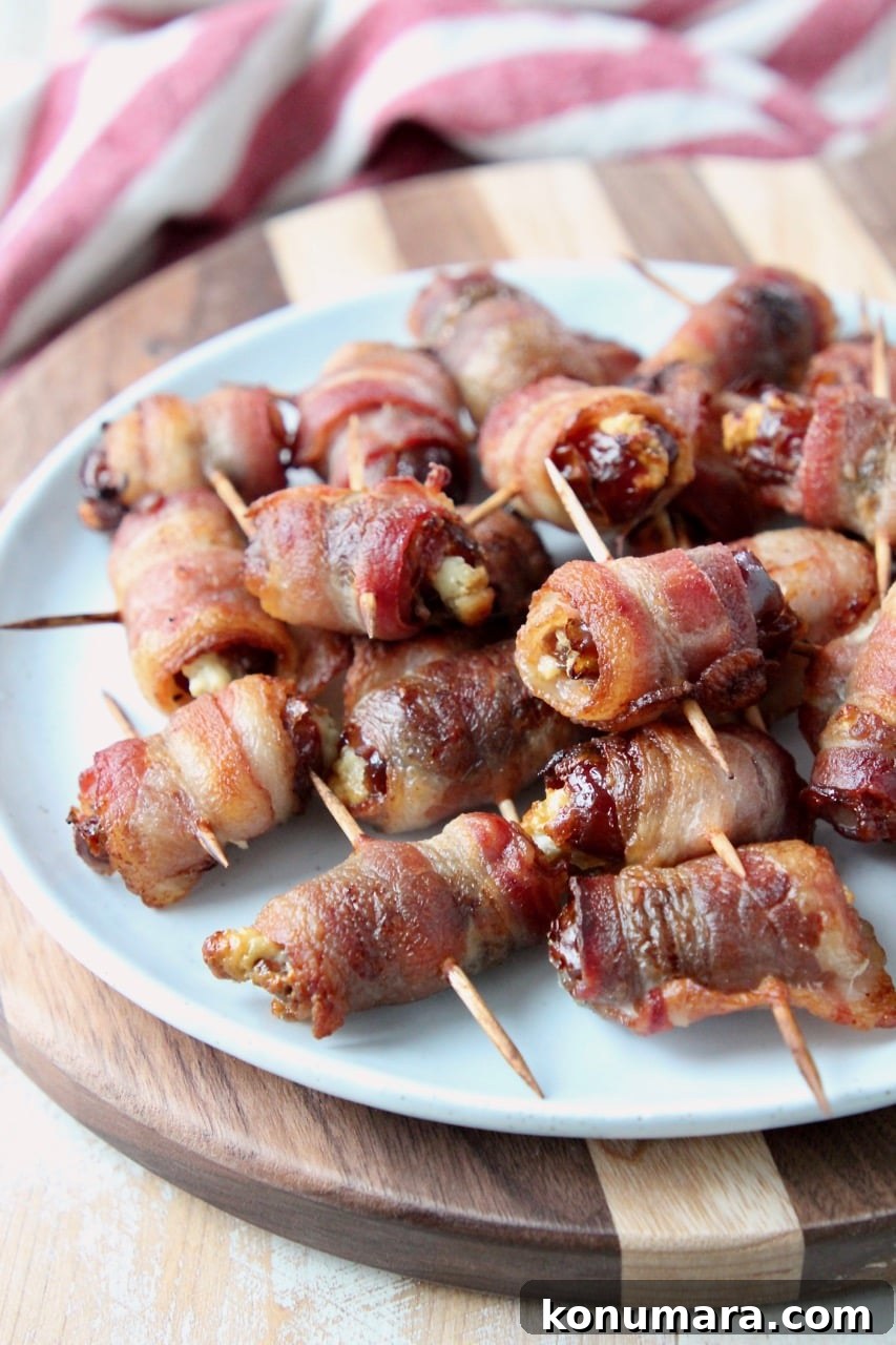 Bacon-Wrapped Dates Appetizer Recipe 5 Bacon wrapped dates piled up on white plate
