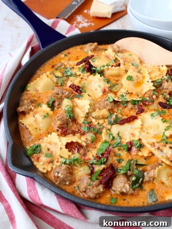 One Pot Ravioli with Creamy Pesto Sauce & Sausage plated