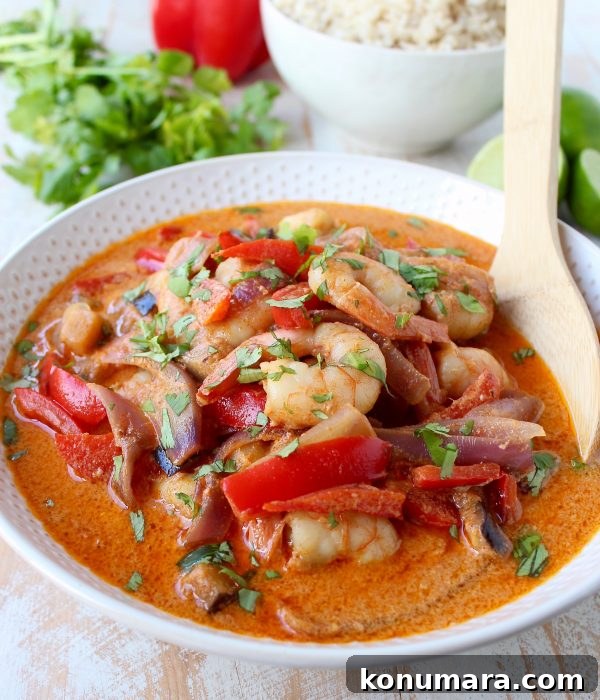Shrimp & vegetables are cooked into a simple, delicious red curry sauce in this Red Curry Shrimp recipe, made in only 20 minutes for an easy weeknight meal!