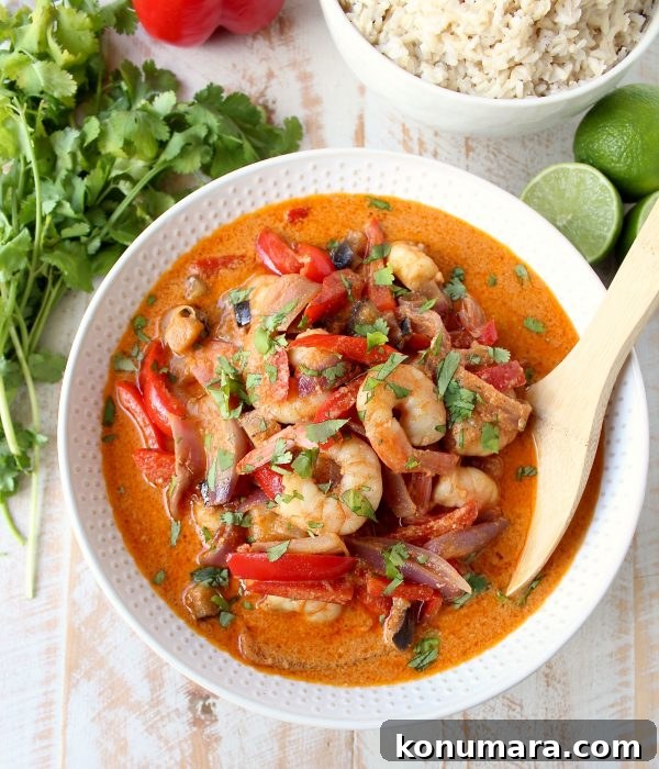 Shrimp & vegetables are cooked into a simple, delicious red curry sauce in this Red Curry Shrimp recipe, made in only 20 minutes for an easy weeknight meal!