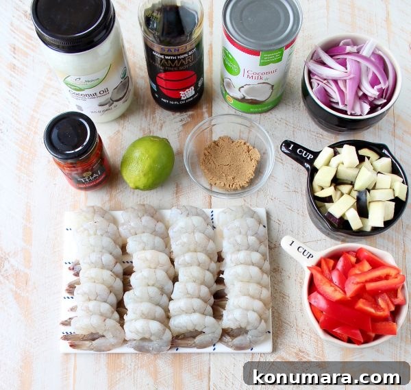 Shrimp & vegetables are cooked into a simple, delicious red curry sauce in this Red Curry Shrimp recipe, made in only 20 minutes for an easy weeknight meal!