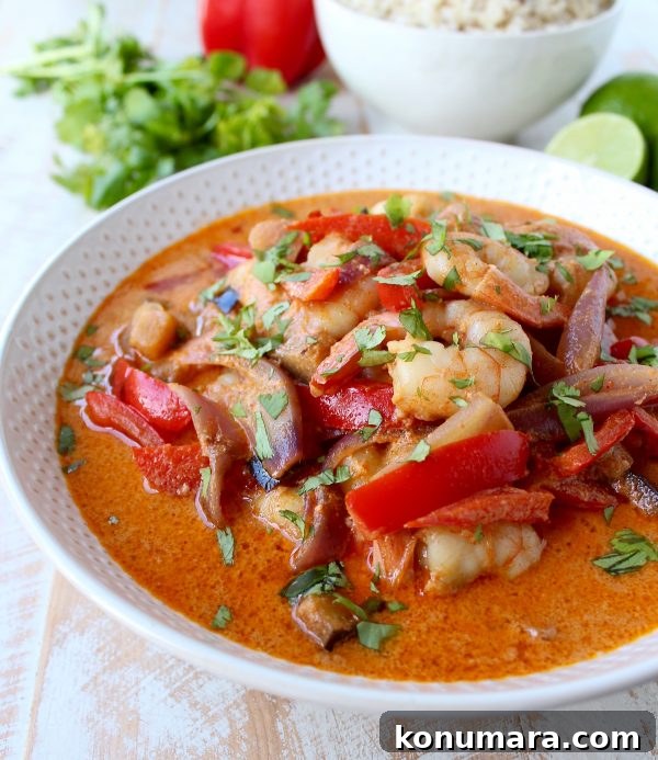 Shrimp & vegetables are cooked into a simple, delicious red curry sauce in this Red Curry Shrimp recipe, made in only 20 minutes for an easy weeknight meal!