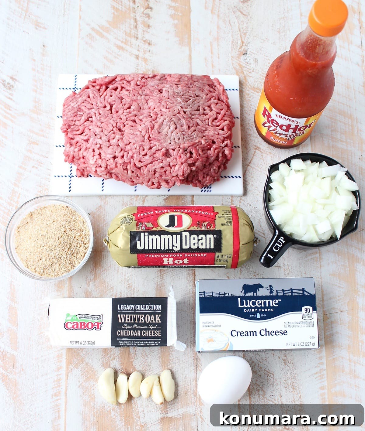 Buffalo-Style Cheesy Meatloaf Recipe 3 ingredients for buffalo cheesy meatloaf on white wood board