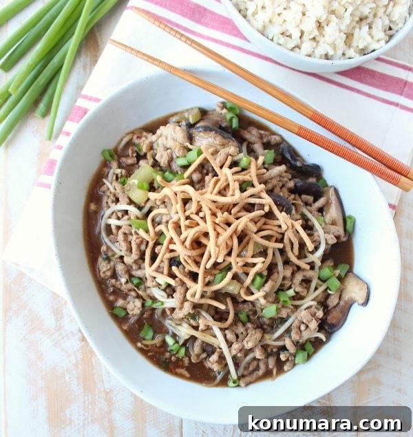 This easy Chinese Pork Chop Suey recipe combines pork, veggies & a delicious Asian sauce, served over white rice, topped with crispy chow mein noodles!
