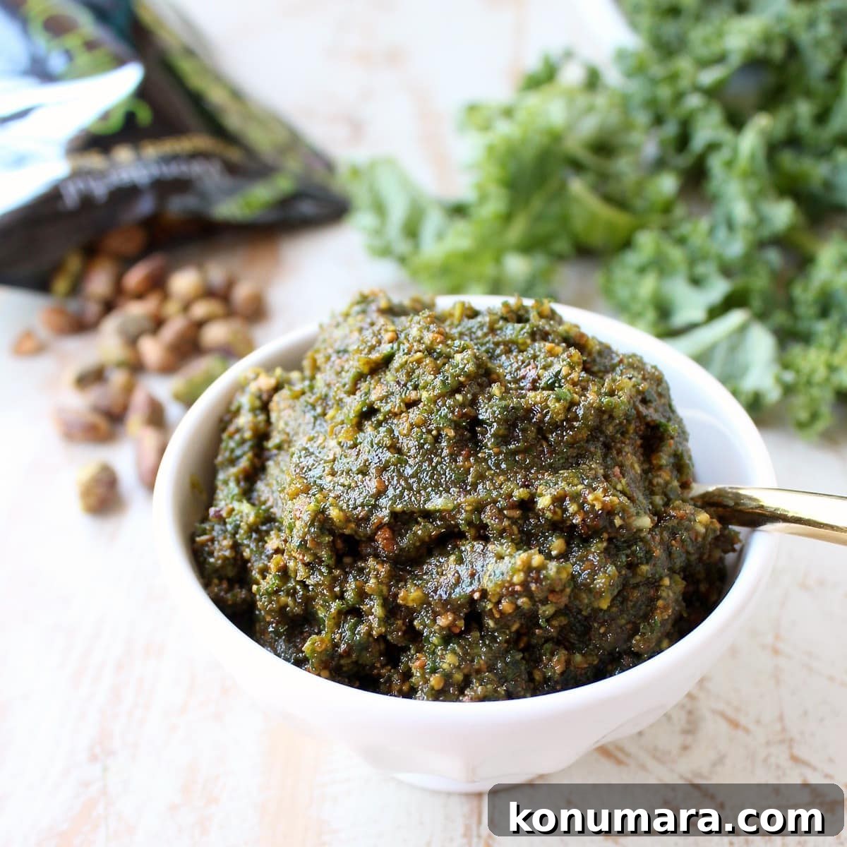 pistachio pesto in a bowl with a spoon