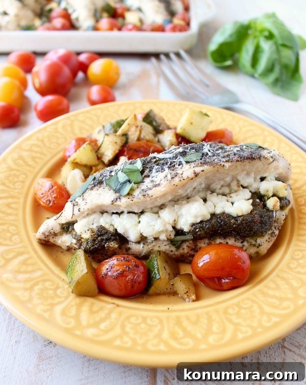 Sheet Pan Stuffed Chicken with Goat Cheese and Pesto 2 Sheet pan chicken stuffed with pesto and goat cheese, served with zucchini and cherry tomatoes