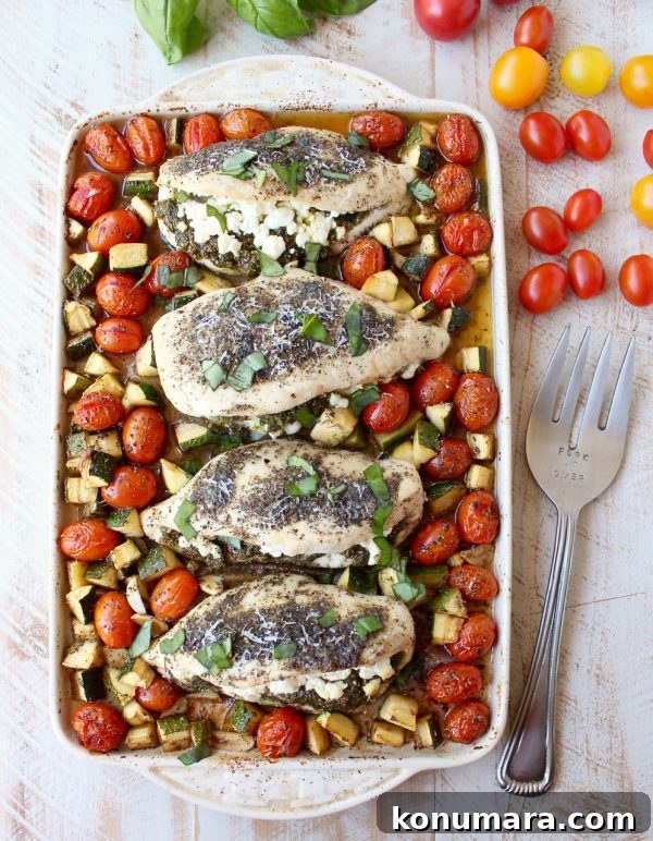Sheet Pan Stuffed Chicken with Goat Cheese and Pesto 9 Finished sheet pan chicken with roasted vegetables