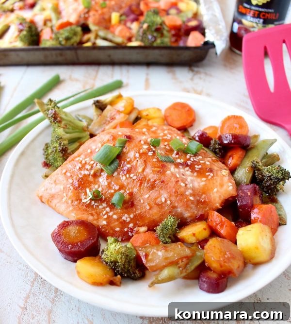 Sheet-Pan Salmon with Thai Sweet Chili Glaze 5 Close up of glazed salmon with sesame seeds