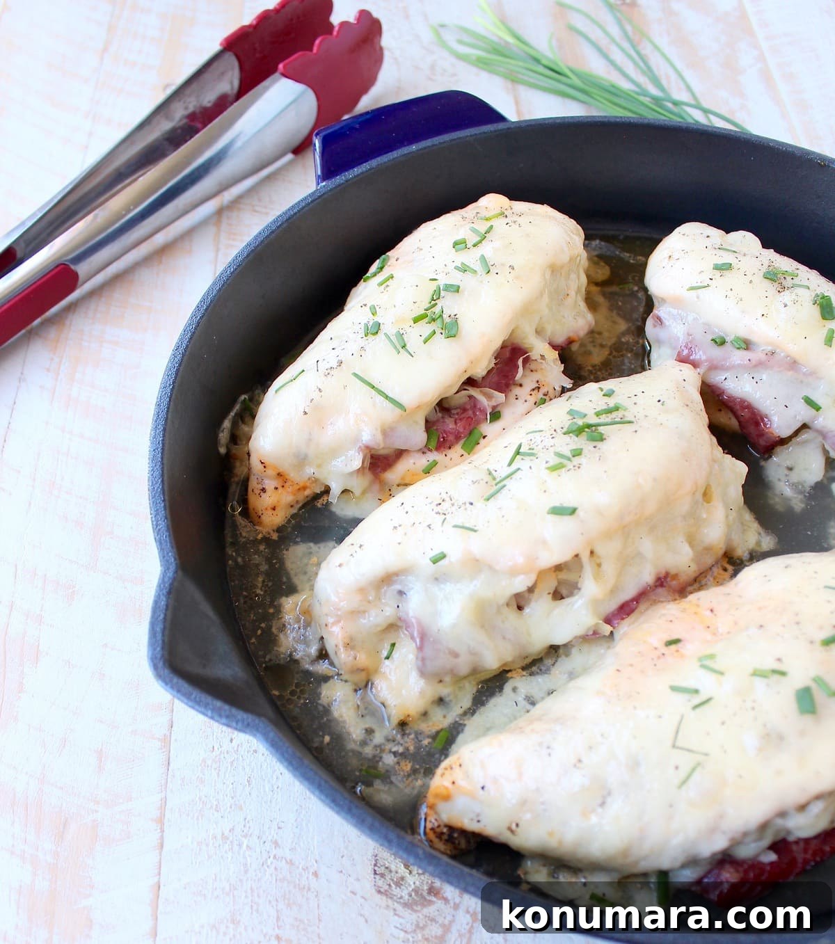 Reuben chicken is tossed with thousand island dressing, stuffed with sauerkraut & corned beef & topped with swiss cheese for a tasty, easy dinner recipe!
