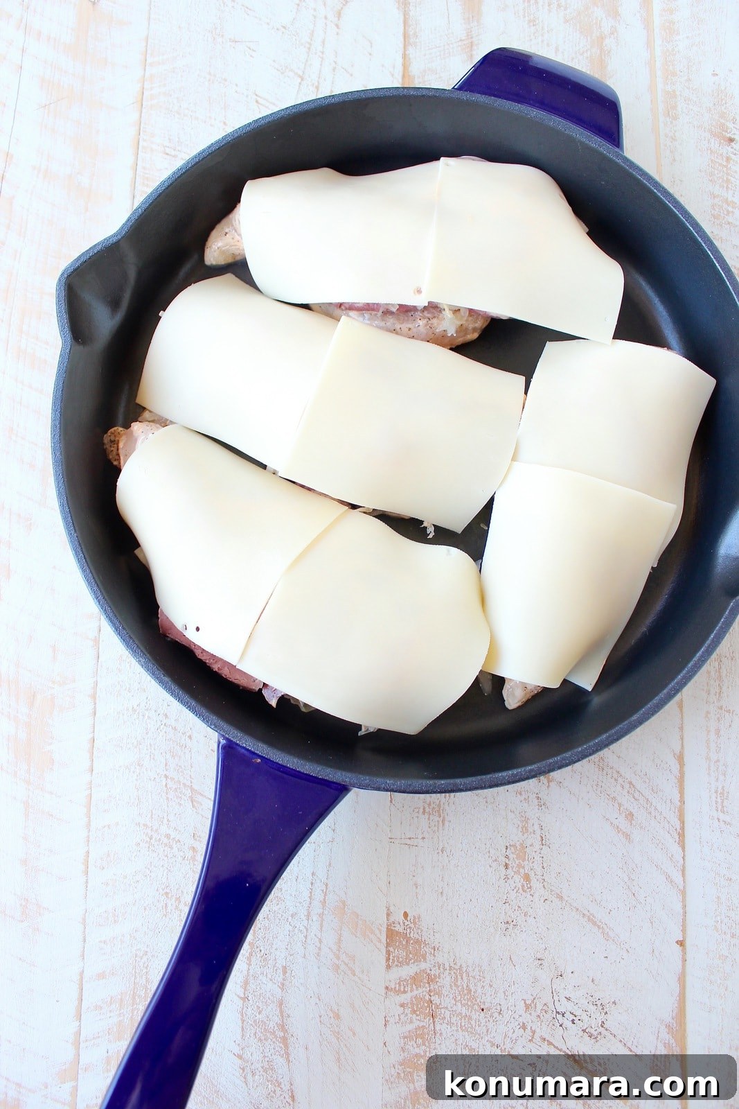 Reuben chicken is tossed with thousand island dressing, stuffed with sauerkraut & corned beef & topped with swiss cheese for a tasty, easy dinner recipe!