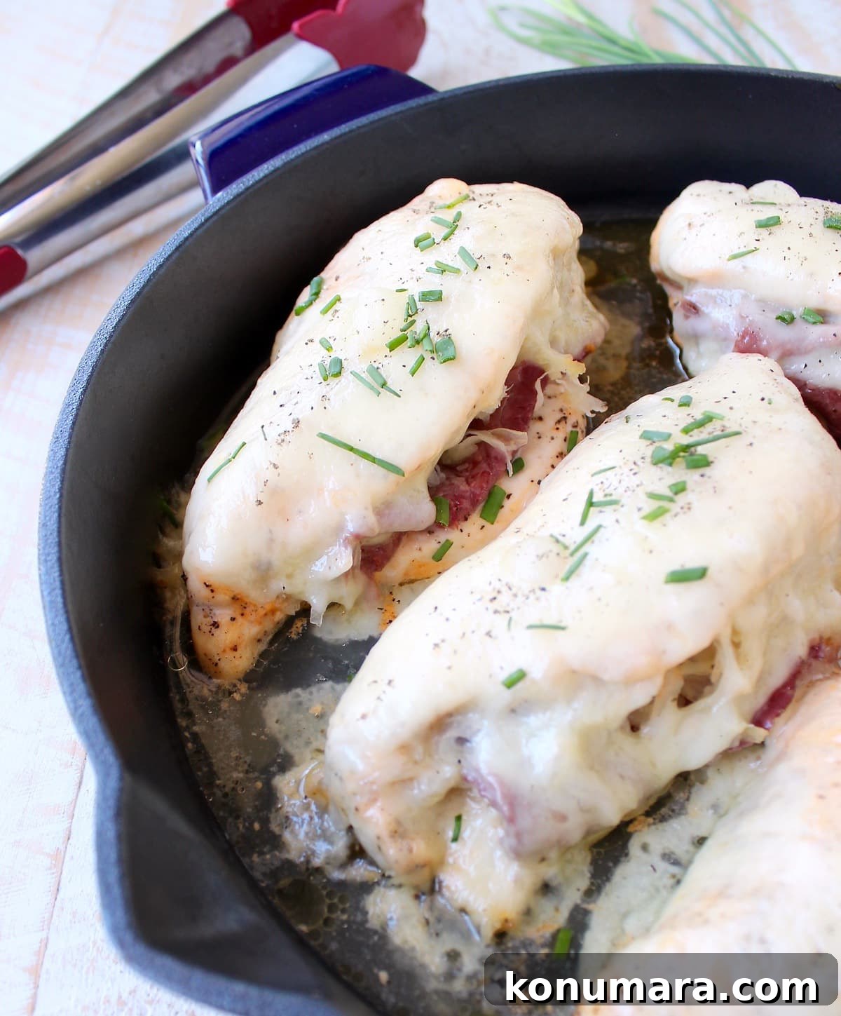 Reuben chicken is tossed with thousand island dressing, stuffed with sauerkraut & corned beef & topped with swiss cheese for a tasty, easy dinner recipe!