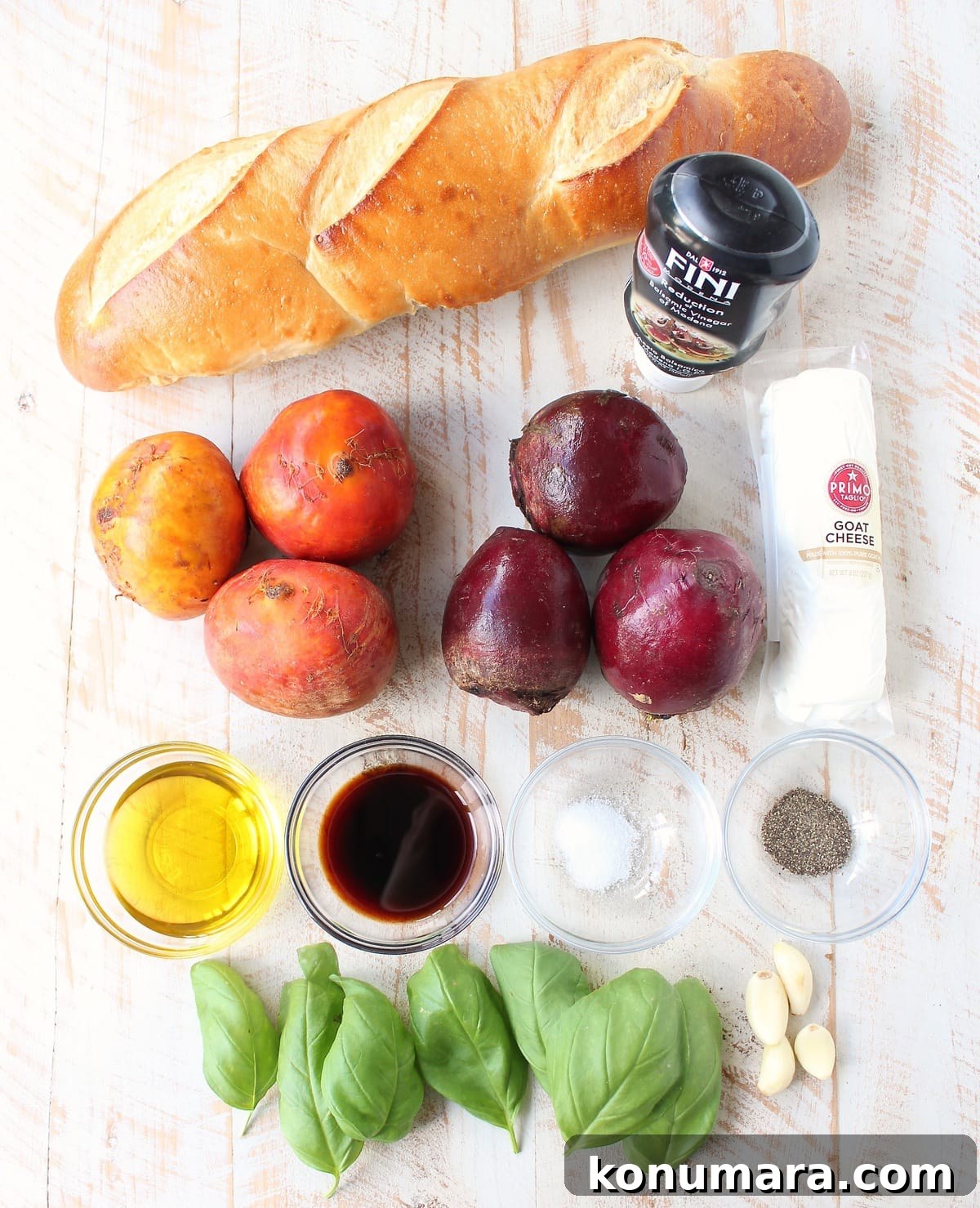ingredients for beet bruschetta on a white wood board