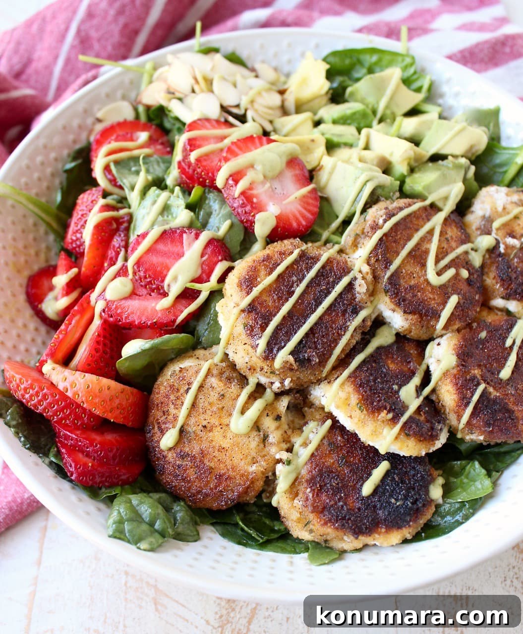 Strawberry Avocado Salad with Crispy Goat Cheese 3 Crispy goat cheese, creamy avocado & juicy strawberries top spinach & arugula, tossed with avocado vinaigrette, for the perfect vegetarian Spring salad!