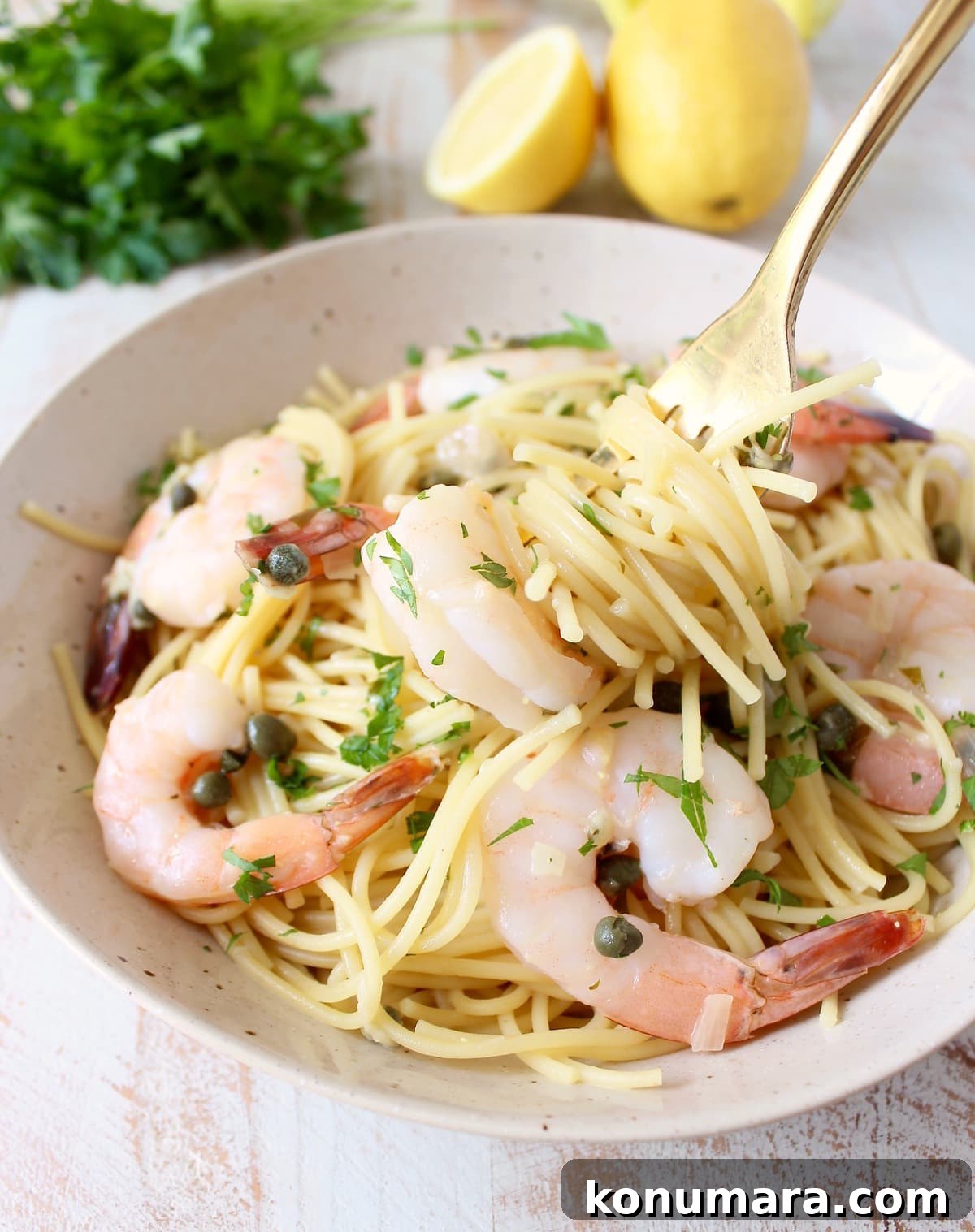 Close up of shrimp piccata pasta with capers