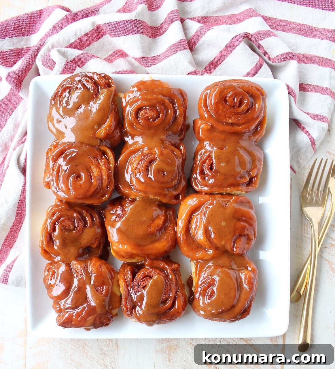 Salted Caramel Cinnamon Rolls Recipe - Gooey, Decadent Treat 12 Salted Caramel Cinnamon Rolls on white square plate