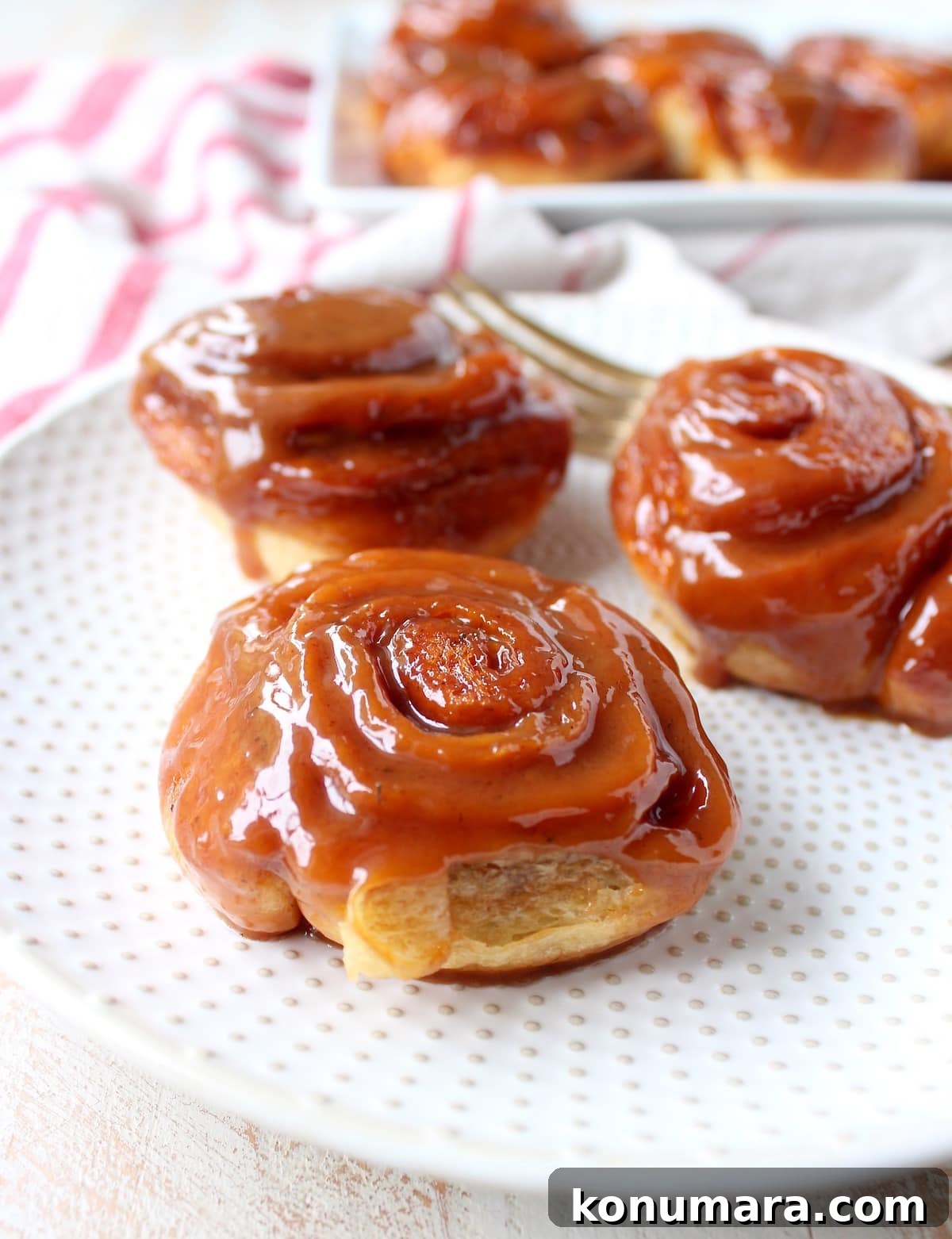 Salted Caramel Cinnamon Rolls Recipe - Gooey, Decadent Treat 17 salted caramel cinnamon rolls on a plate