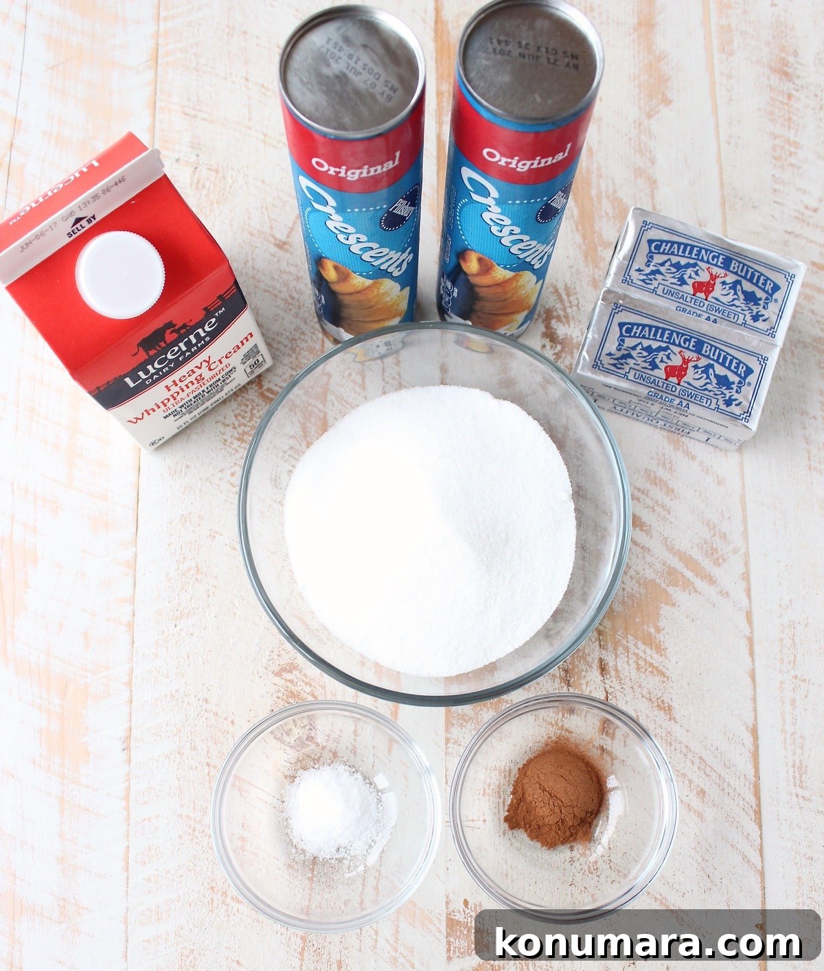 Salted Caramel Cinnamon Rolls Recipe - Gooey, Decadent Treat 5 ingredients for salted caramel cinnamon rolls on white wood board