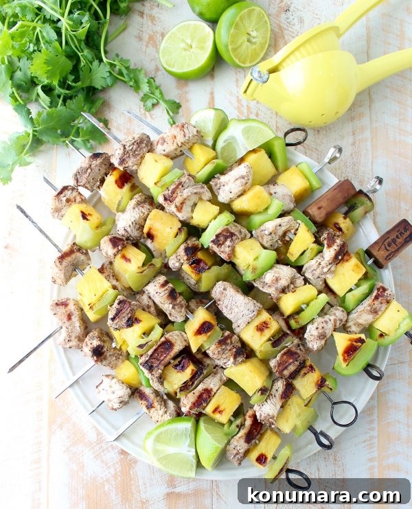 Jerk chicken kabobs with pineapple and bell peppers, the perfect 5-ingredient, gluten free recipe to toss on the grill and serve with honey lime sauce!