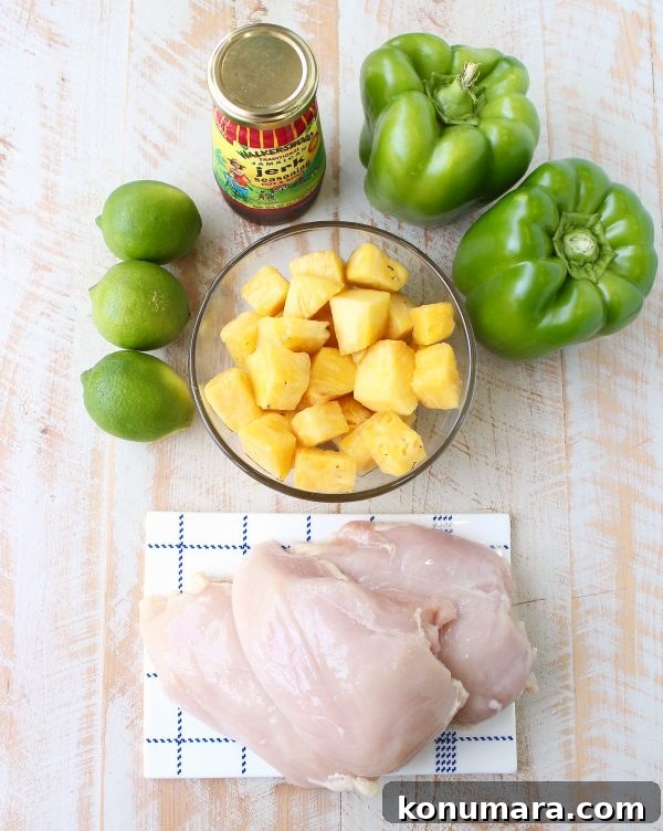 Jerk chicken kabobs with pineapple and bell peppers, the perfect 5-ingredient, gluten free recipe to toss on the grill and serve with honey lime sauce!