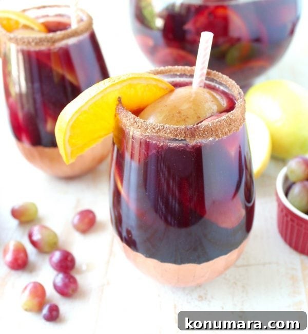 Smoky Grilled Fruit Sangria Recipe for Summer 7 Glasses of grilled fruit sangria on a table