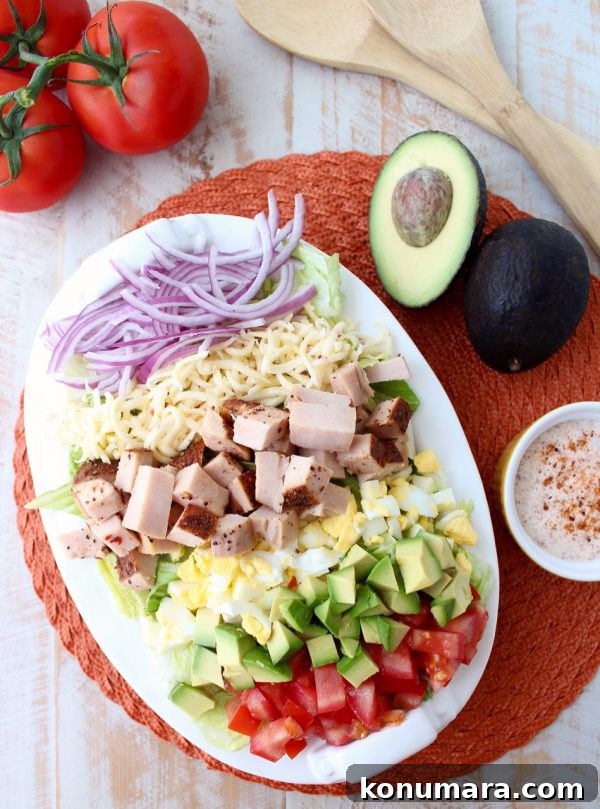 Spicy Cajun Turkey Cobb Salad Recipe 2 Colorful Cajun Turkey Cobb Salad topped with avocado, tomatoes and creamy Cajun ranch dressing