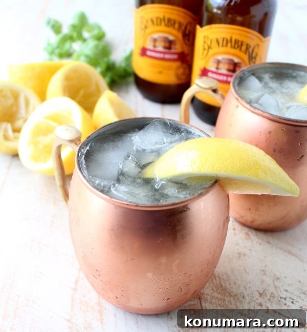 Spiked Ginger Lemonade Cocktail Recipe 4 Pouring ginger beer into a glass of lemonade