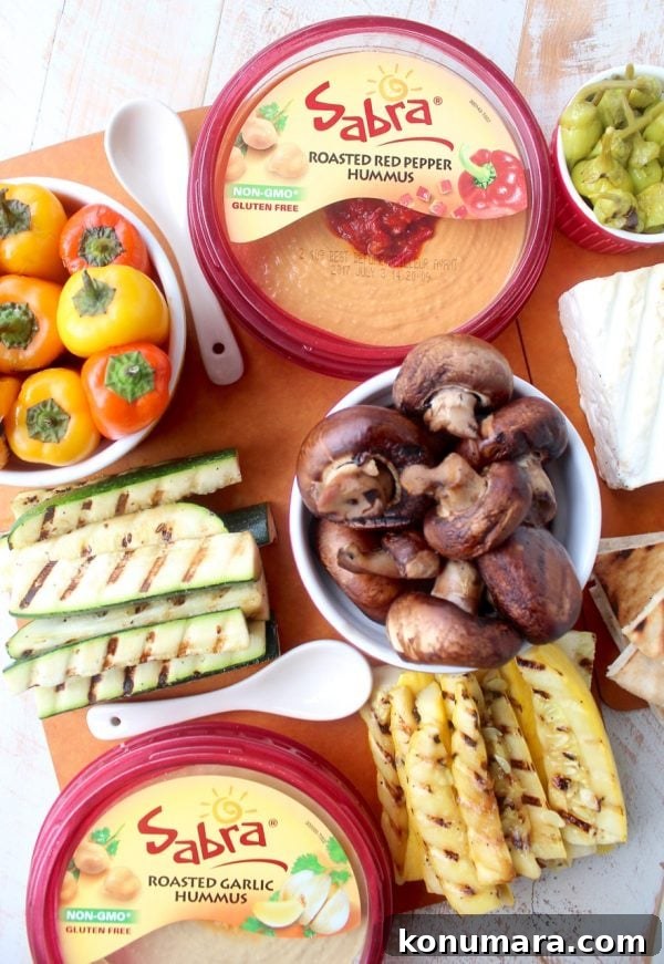Mediterranean Grilled Vegetables and Hummus Platter 5 Mediterranean grilled vegetables, pita bread & feta cheese are served with an assortment of flavored hummus on this delicious veggie & hummus plate!