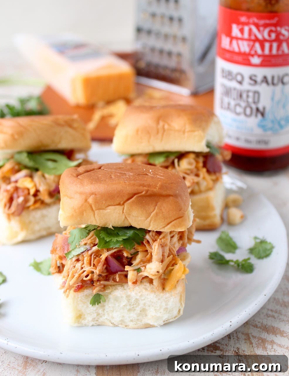These scrumptious BBQ Chicken Salad Sliders are made with BBQ chicken tossed with cheddar cheese, bacon, corn & onions, served on sweet Hawaiian rolls!