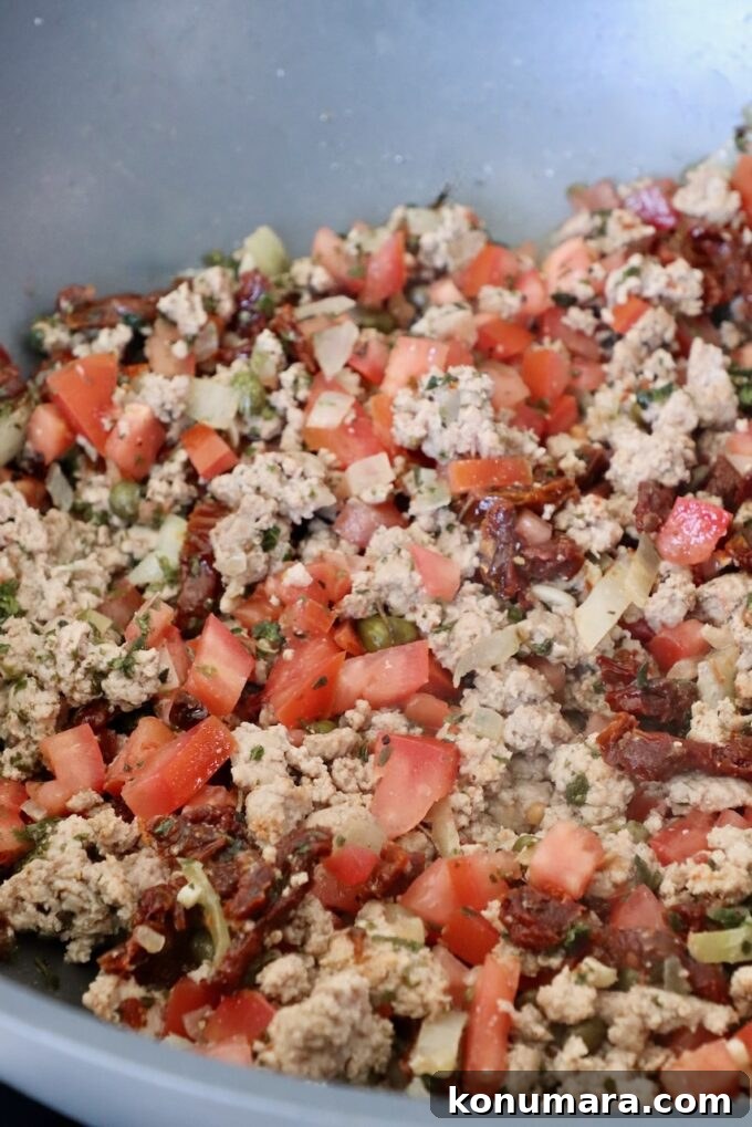 One-Pot Greek Pasta with Feta, Olives and Tomatoes 5 ground turkey in pan with diced tomatoes and spices