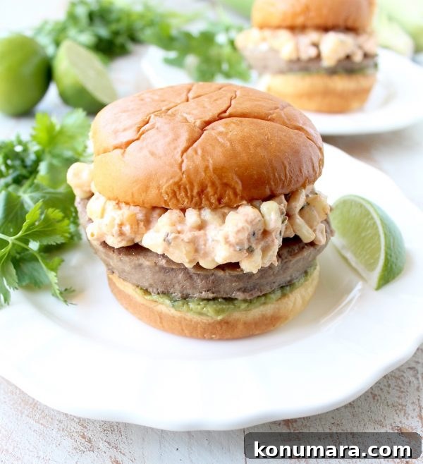 Mexican Street Corn (Elote) Turkey Burgers 2 Mexican turkey burgers are covered in cotija cheese, guacamole and grilled Mexican street corn for a flavorful summer burger recipe!