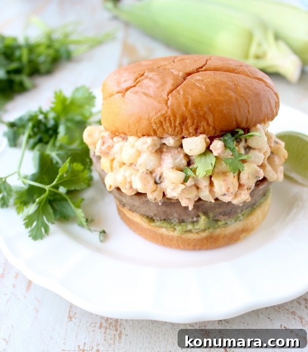 Mexican Street Corn (Elote) Turkey Burgers 3 Mexican turkey burgers are covered in cotija cheese, guacamole and grilled Mexican street corn for a flavorful summer burger recipe!