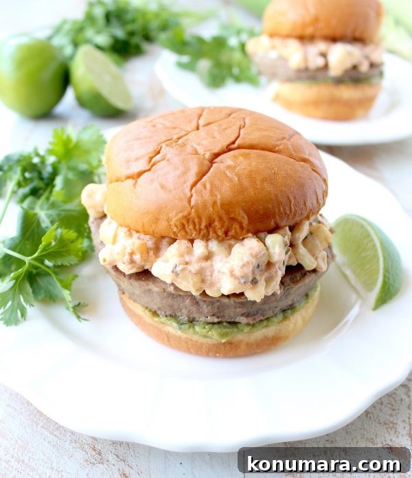 Mexican Street Corn (Elote) Turkey Burgers 4 Mexican turkey burgers are covered in cotija cheese, guacamole and grilled Mexican street corn for a flavorful summer burger recipe!