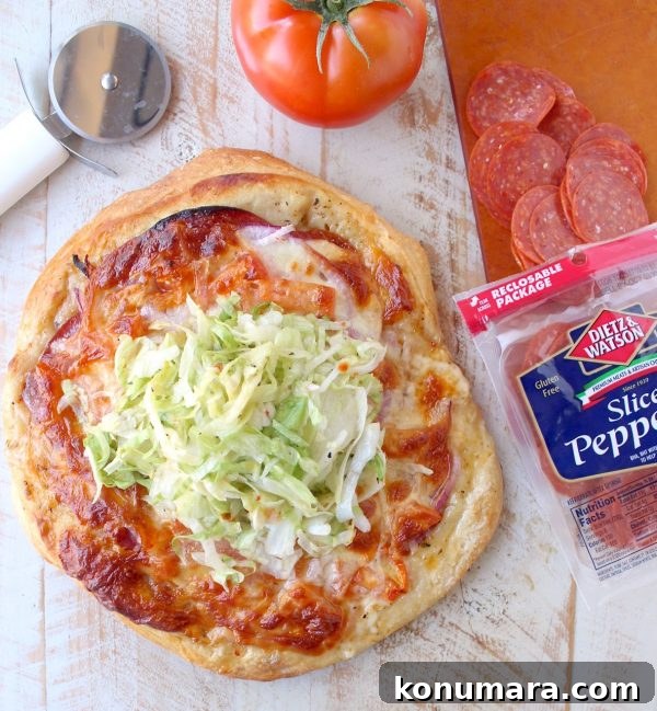 Italian Sub Pizza Recipe: Loaded Meats, Provolone and Herbs 7 All of the ingredients in a traditional Italian Sub, like salami, pepperoni & provolone, top this delicious Italian Sub Pizza Recipe, easily made in under 30 minutes in the oven or on the grill!