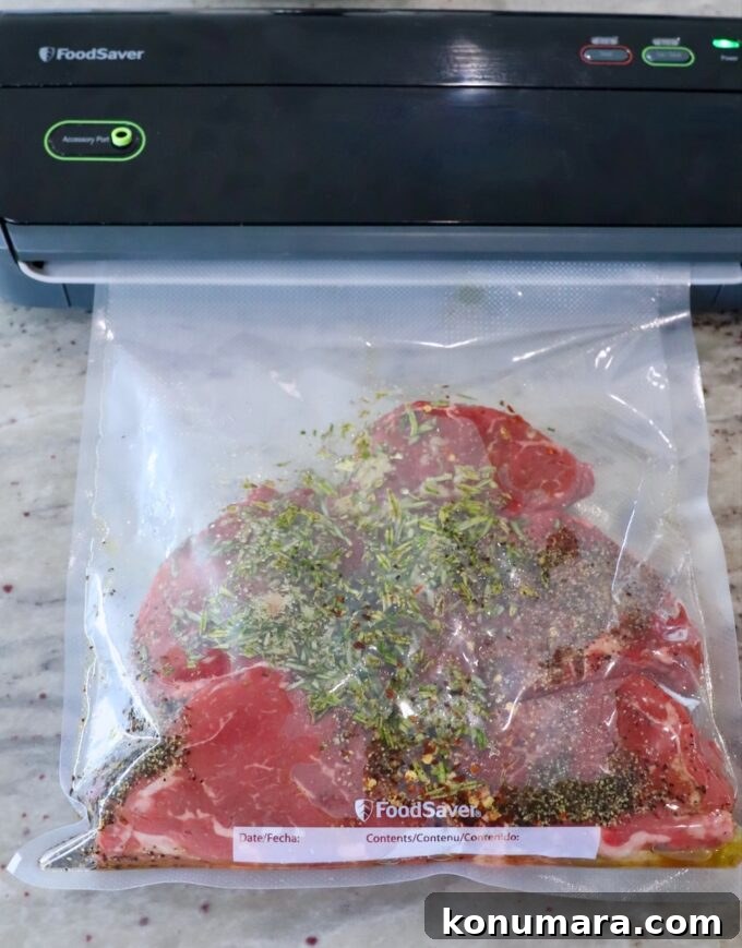 Seared Steak Crostini Recipe with Garlic Herb Butter 4 seasoned sirloin steaks in a clear bag in a vacuum sealer