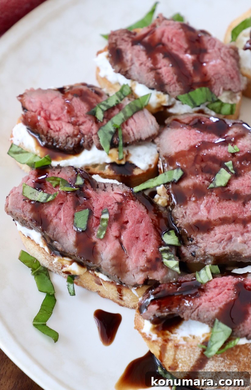 Seared Steak Crostini Recipe with Garlic Herb Butter 8 cooked sliced steak on baguette slices
