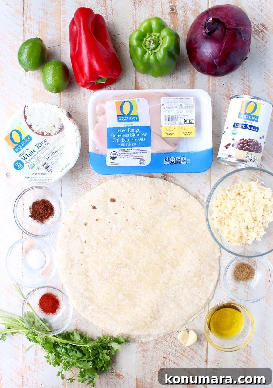 ingredients for grilled chicken burritos on white wood board