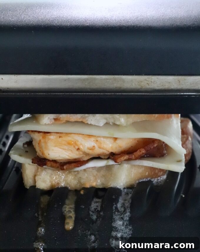 Grilled Chicken Panini Recipe with Melty Mozzarella 9 chicken panini sandwich in a panini press