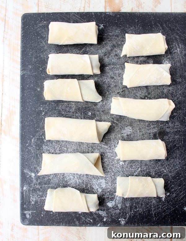 Crispy Jalapeño Popper Egg Rolls with Cream Cheese 8 Frying until golden