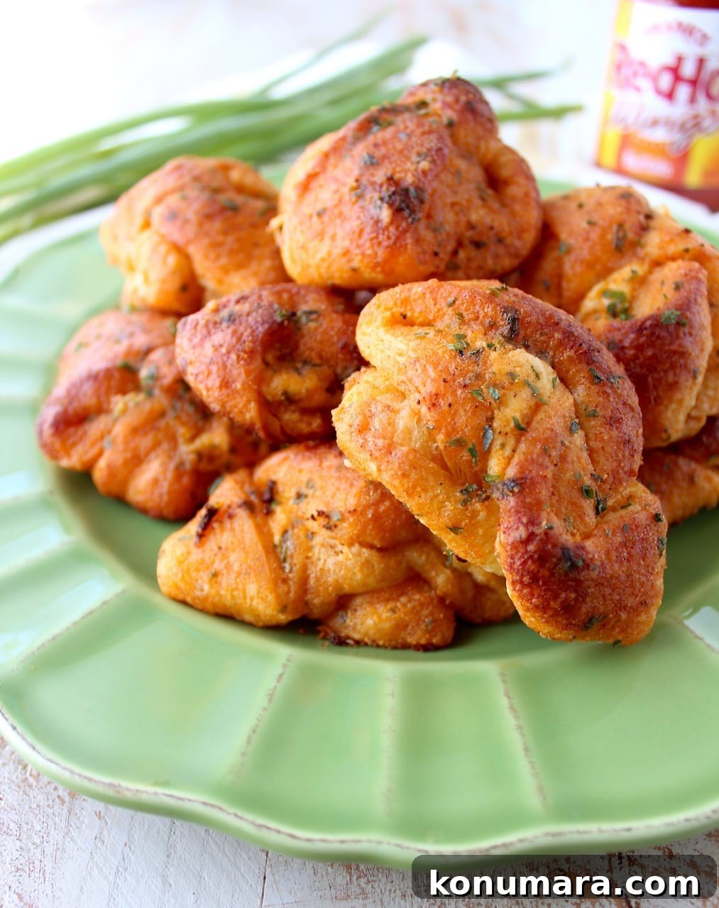 Spicy Buffalo Cheesy Garlic Knots Recipe 2 Buffalo Cheesy Garlic Knots - garlic knots filled with cheese and smothered in buffalo sauce
