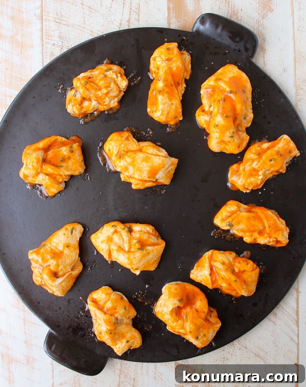 Spicy Buffalo Cheesy Garlic Knots Recipe 6 Plate of buffalo cheesy garlic knots with dipping sauce