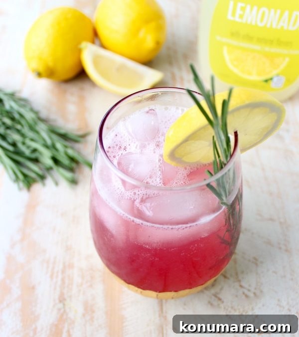 Close-up of spiked cranberry lemonade with rosemary