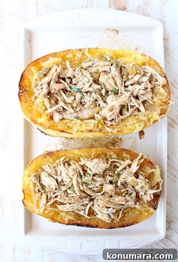 roasted spaghetti squash cut in half filled with green chili chicken