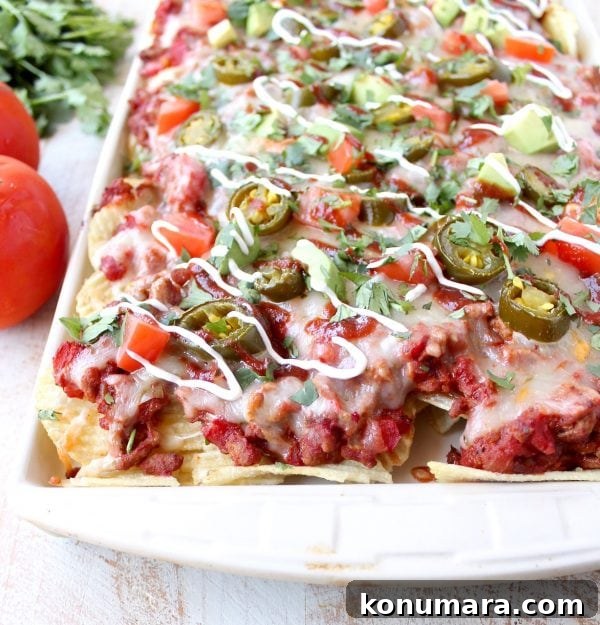 Final serving of Sloppy Joe Nachos piled high with toppings