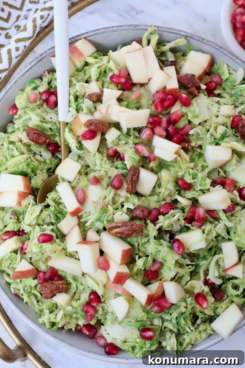 brussel sprout salad in a bowl with a spoon
