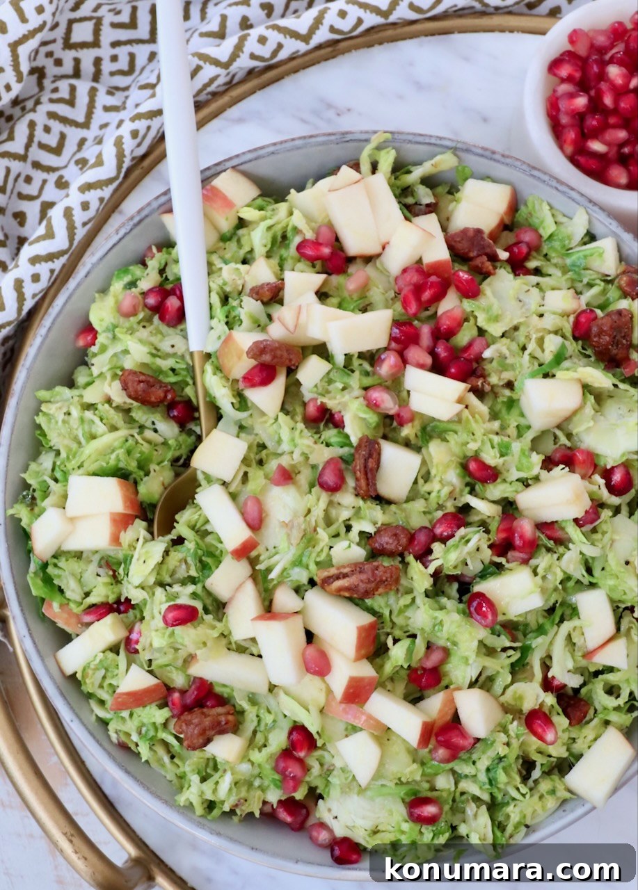 brussels sprout salad in a bowl with a spoon
