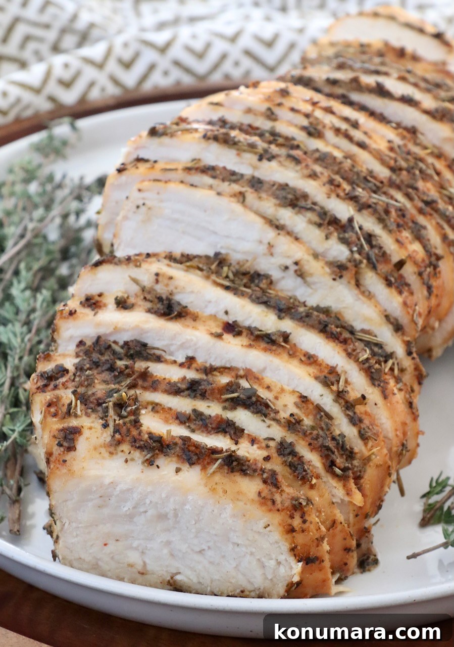 Juicy Slow-Cooker Turkey Breast Recipe 11 sliced turkey breast on a plate