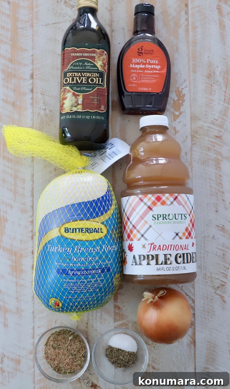 Juicy Slow-Cooker Turkey Breast Recipe 3 ingredients for maple apple turkey breast on a white wood board