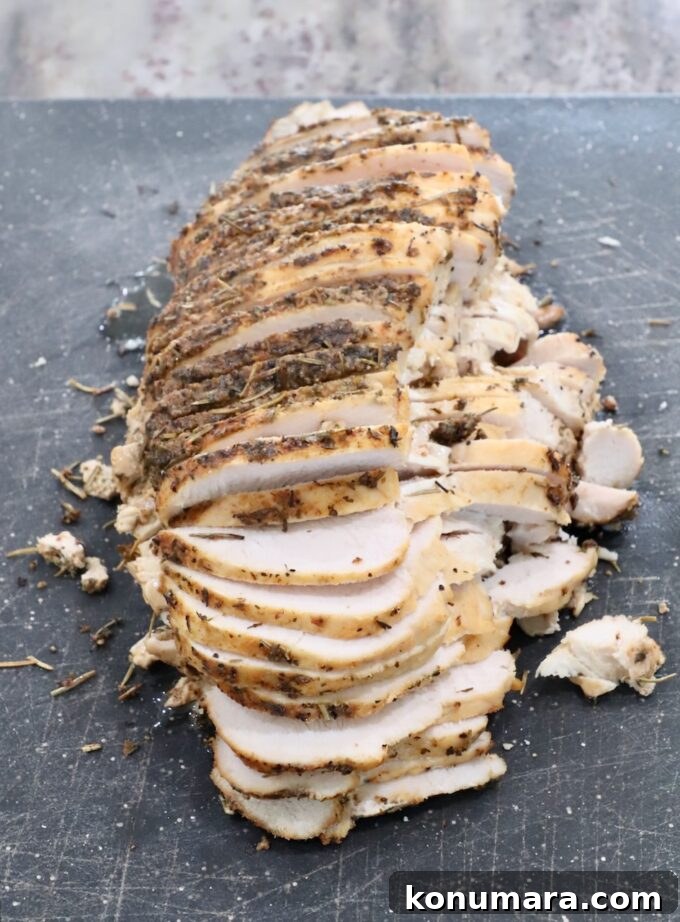 Juicy Slow-Cooker Turkey Breast Recipe 9 sliced turkey breast on a cutting board